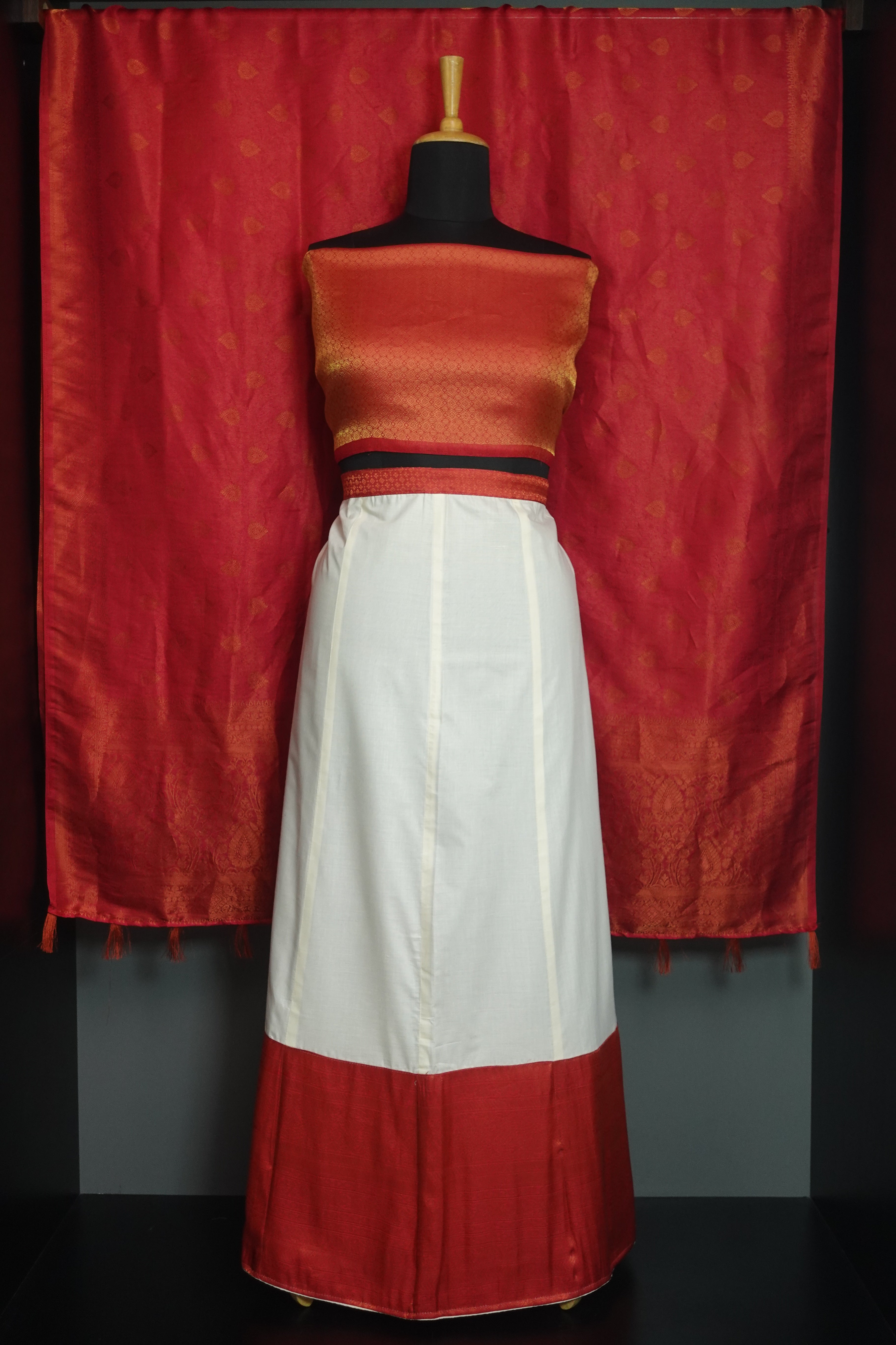 Brocade and Kerala cotton dhavani set — the three-piece half saree with skirt, blouse and pinned shoulder drape