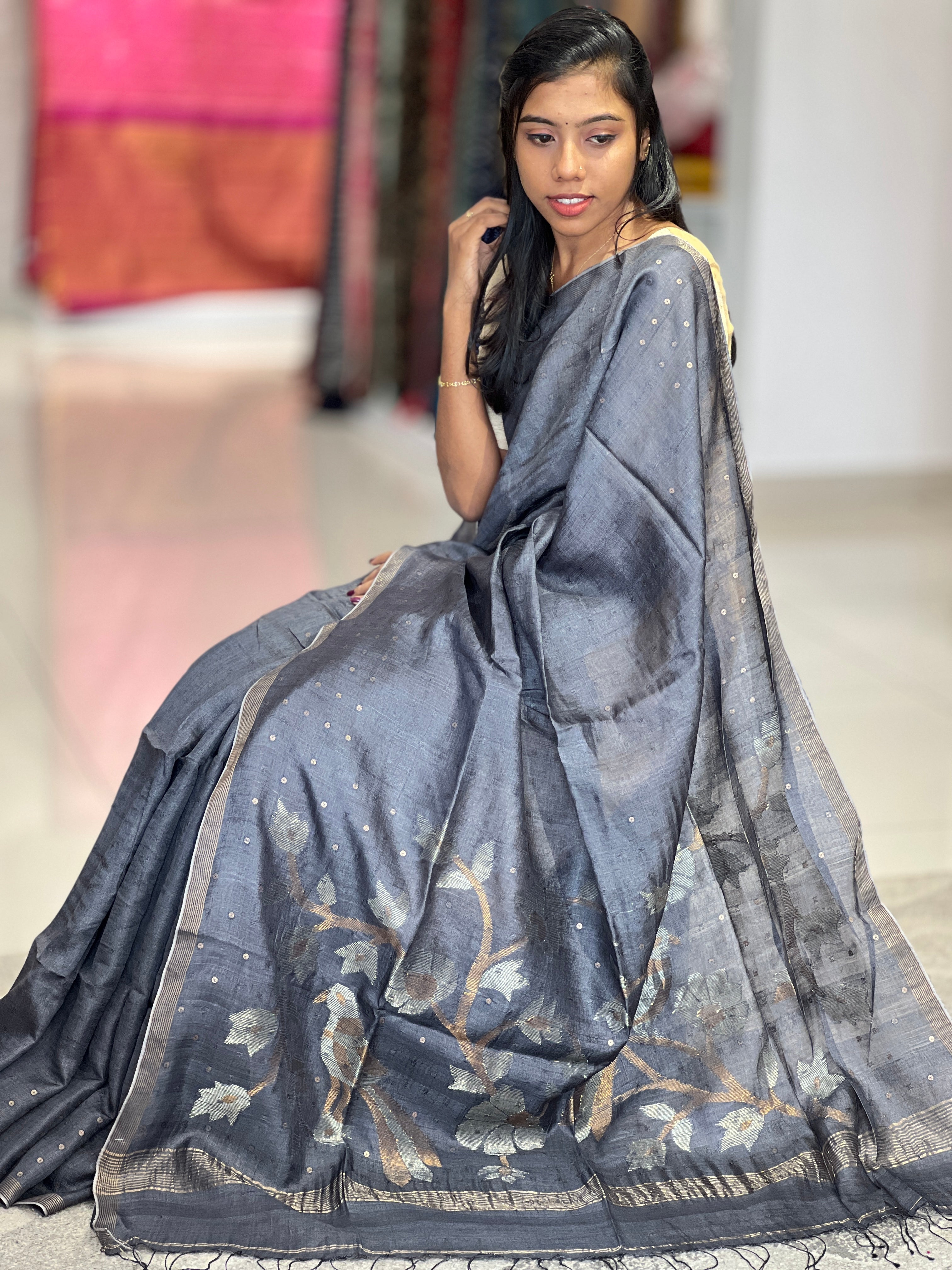 Metal petal weaved pure tussar saree showing the natural gold-beige tone of tussar silk