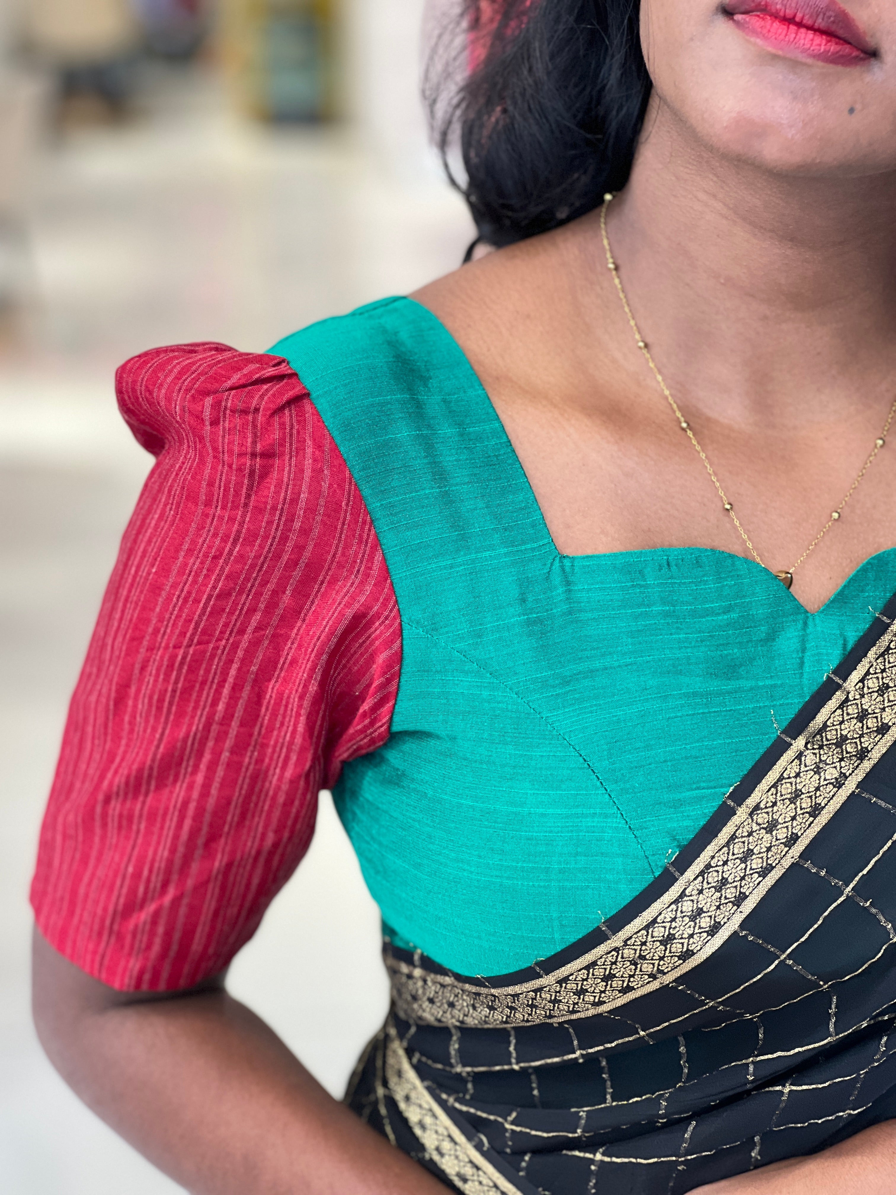A princess-cut patterned cotton blouse showing a clean fitted silhouette