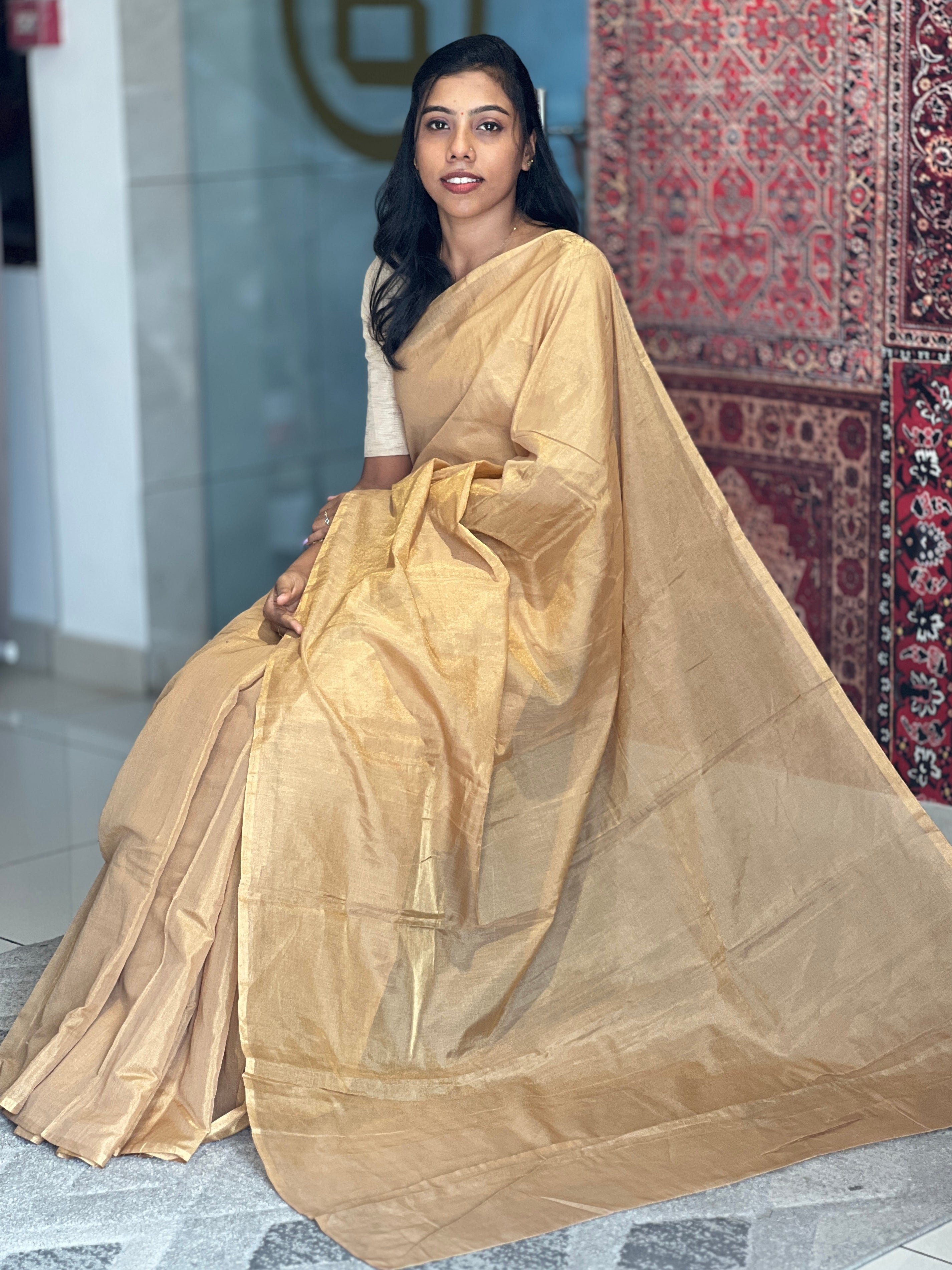 Ivory tissue saree suitable for a First Holy Communion in a Kerala church