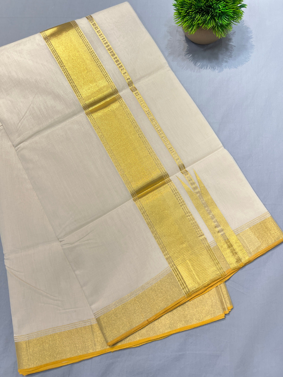A zari-woven pure handloom Kerala cotton saree