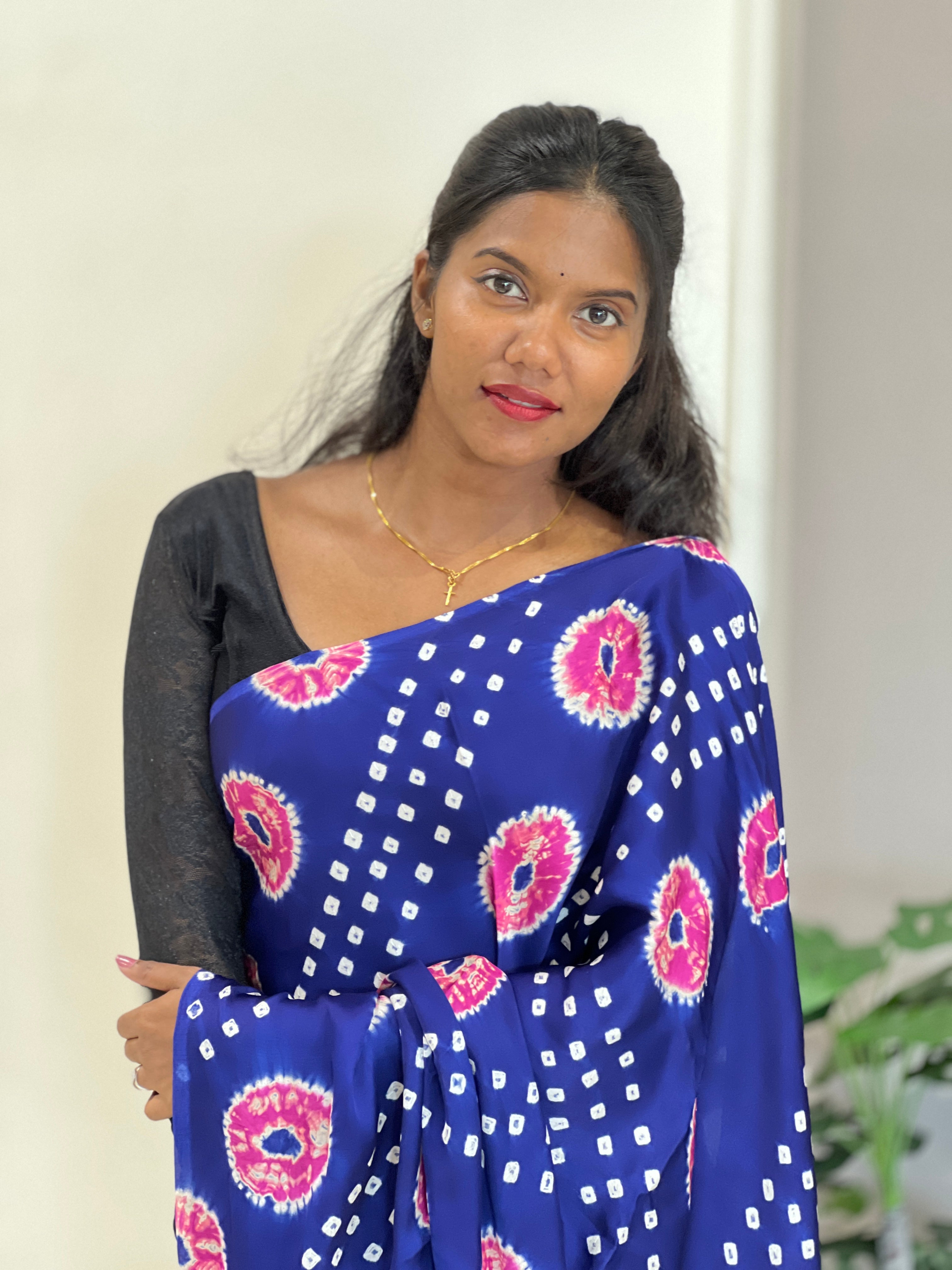 Lagdi patta with tie and dye detailed modal silk saree with a fluid drape and soft sheen