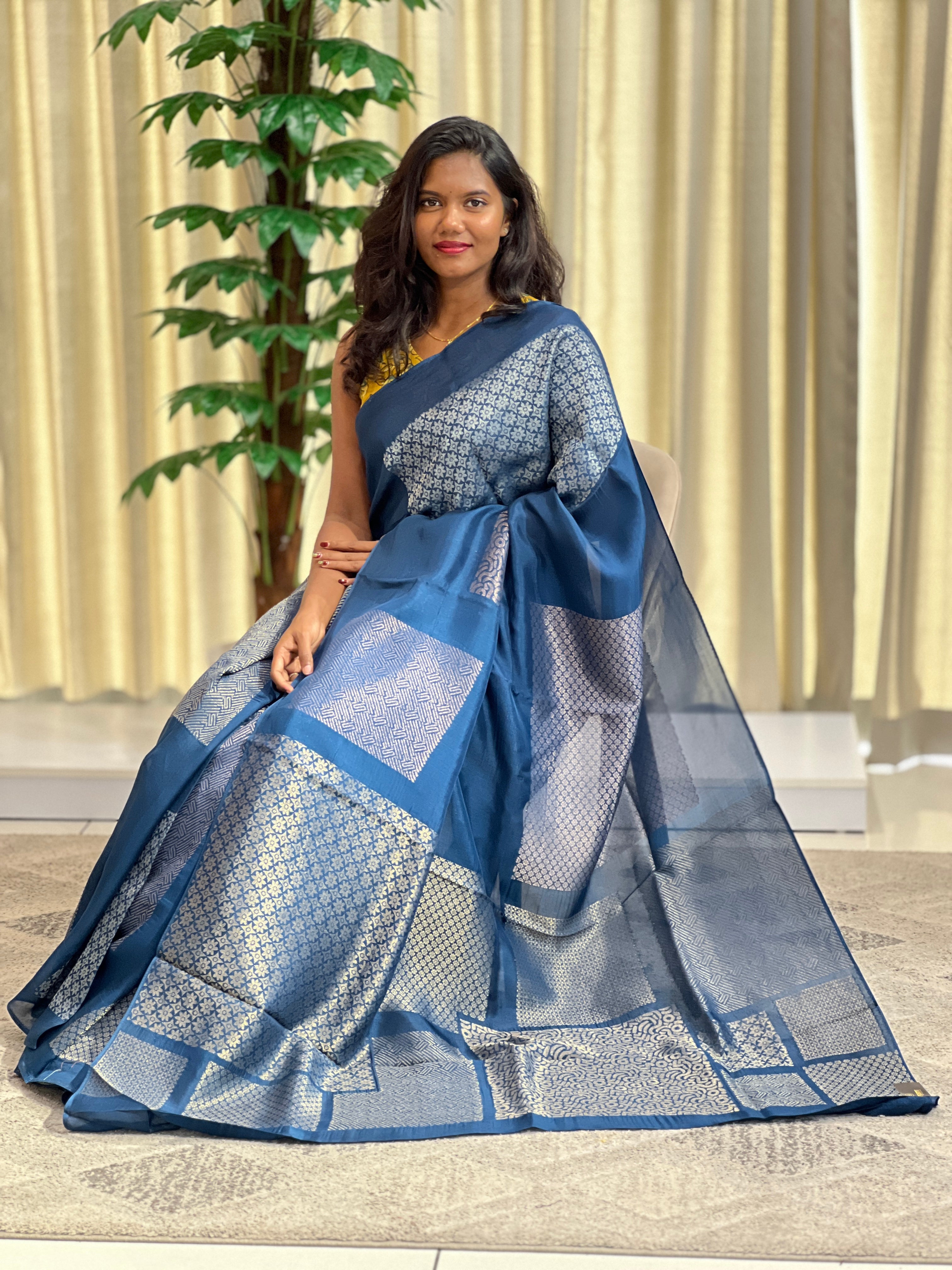 Geometric woven pattern semi tussar saree showing the characteristic slubby texture of tussar silk