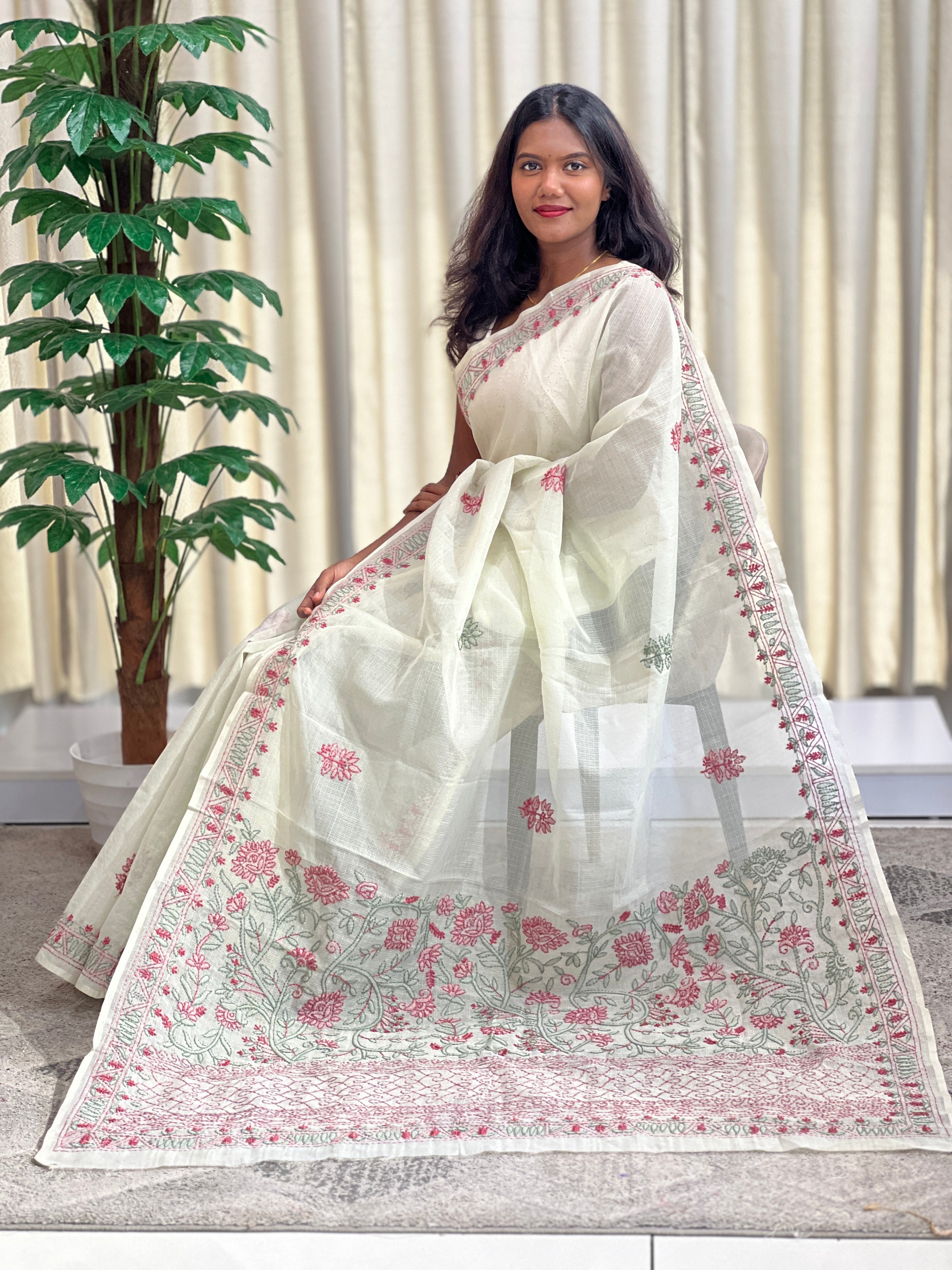 Hand embroidered muga check organza saree with a crisp sheer body that holds its shape