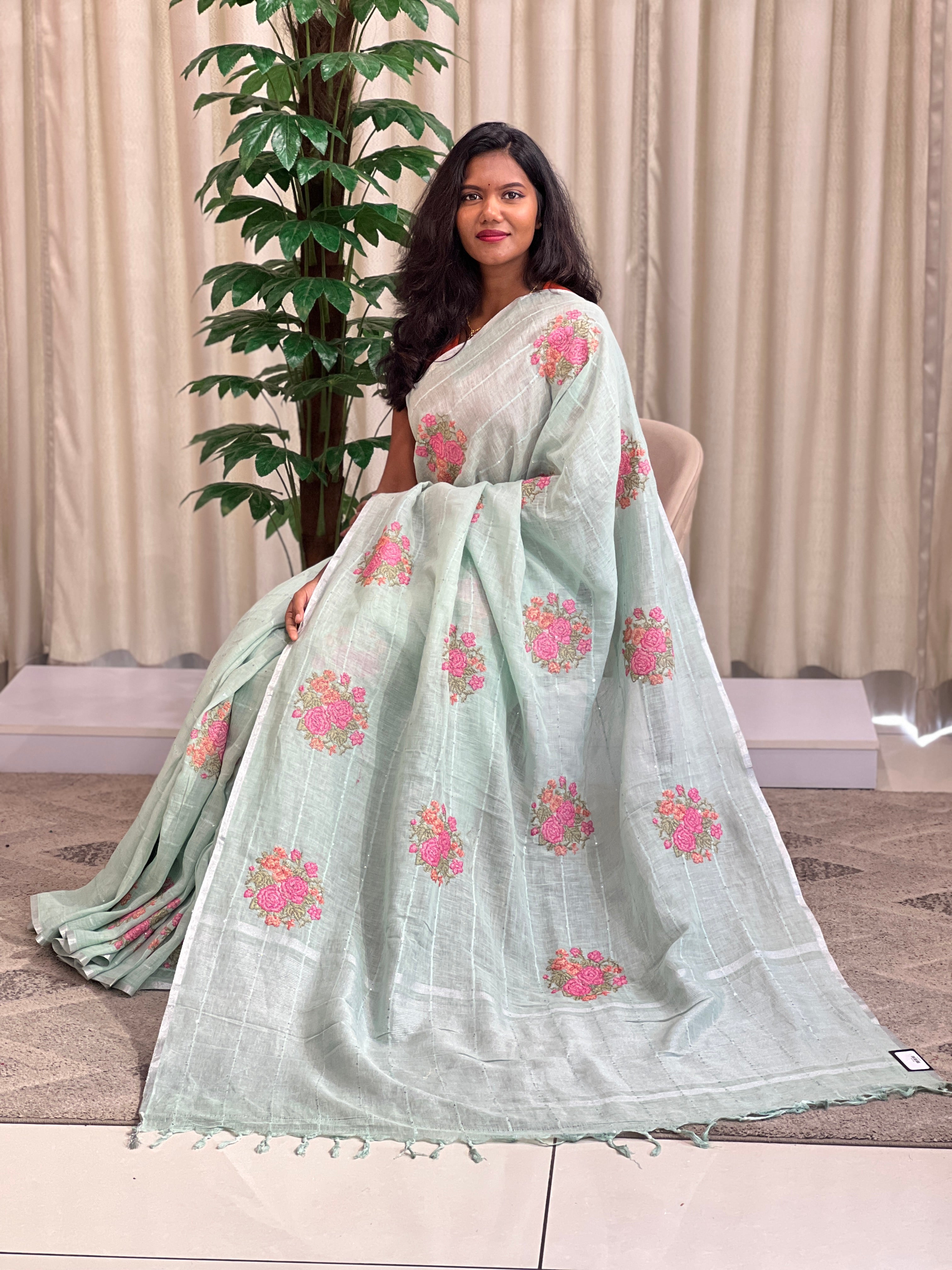Cross stitch pattern linen saree with a crisp textured weave
