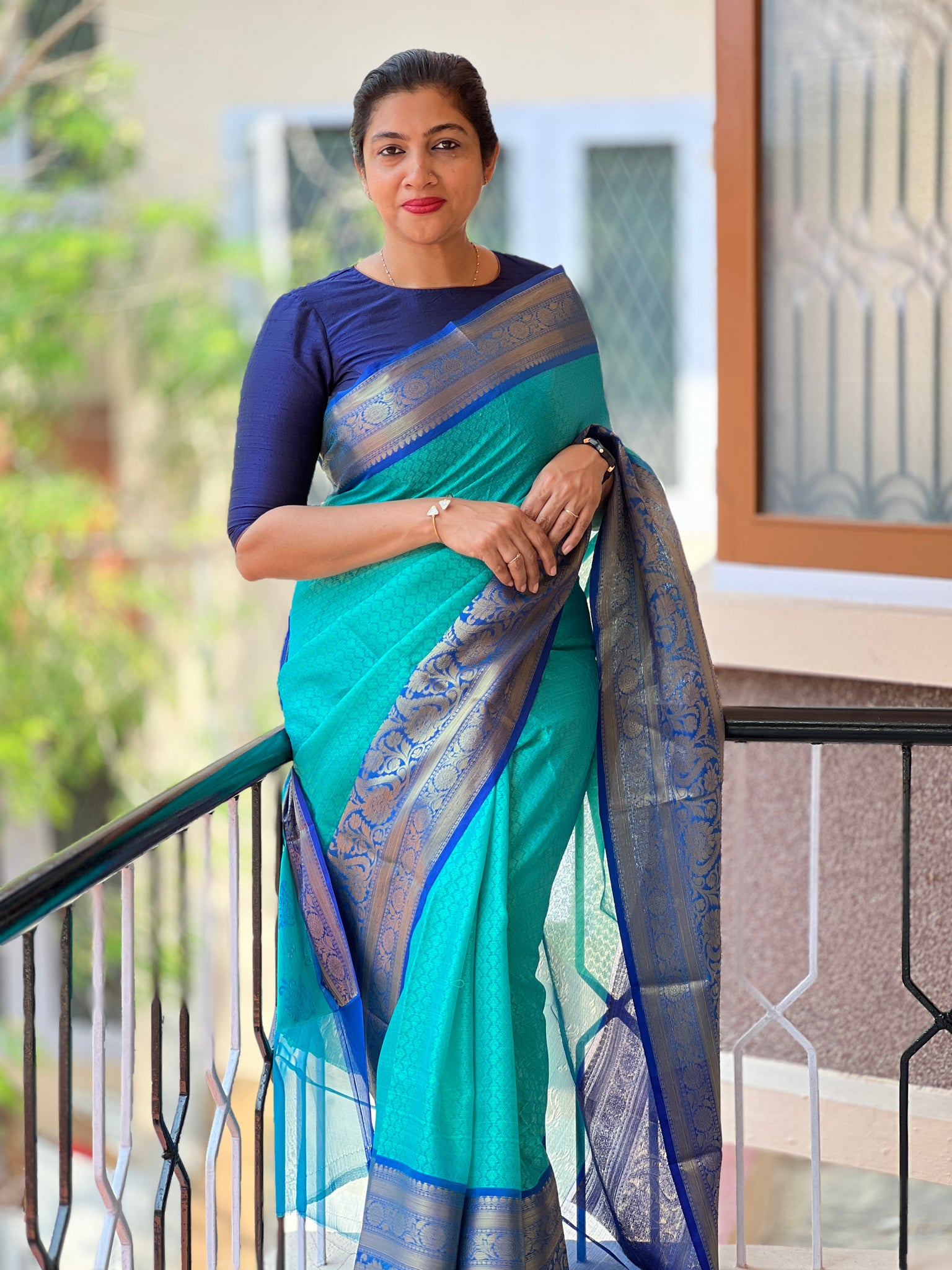 Stunning peacock blue and green color combination pattu saree with big gold  jari from Studio Ayana